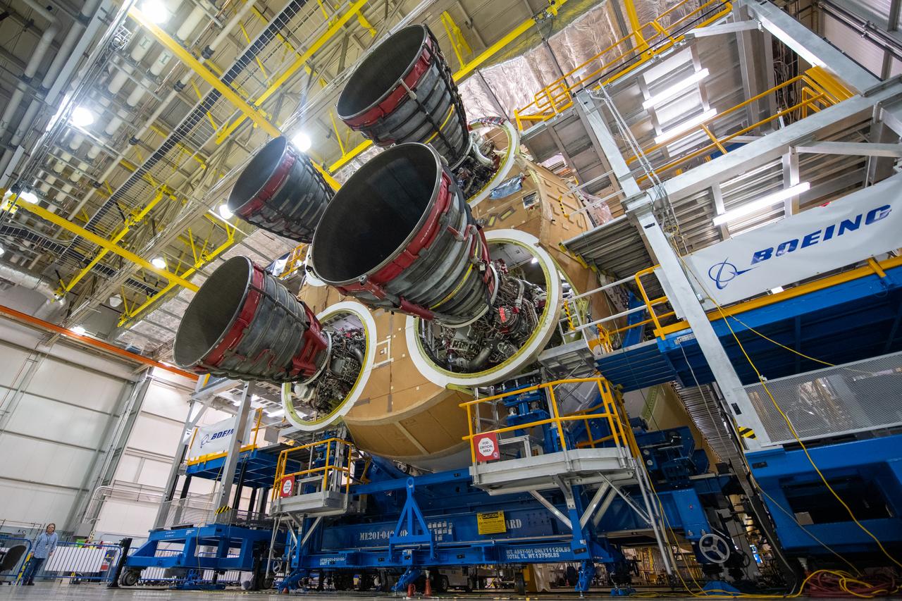This photo shows all four RS-25 engines attached to the core stage for NASA’s Space Launch System rocket for the agency’s Artemis I mission to the Moon. To complete assembly of the rocket stage, engineers and technicians at NASA’s Michoud Assembly Facility in New Orleans are now integrating the propulsion and electrical systems within the structure. The completed core stage with all four RS-25 engines attached is the largest rocket stage NASA has built since the Saturn V stages for the Apollo Program that first sent Americans to the Moon. The stage, which includes two propellant tanks, provides more than 2 million pounds of thrust to send Artemis I to the Moon. Engineers and technicians attached the fourth RS-25 engine to the rocket stage Nov. 6 just one day after structurally mating the third engine. The first two RS-25 engines were structurally mated to the stage in October. After assembly is complete, crews will conduct an integrated functional test of flight computers, avionics and electrical systems that run throughout the 212-foot-tall core stage in preparation for its completion later this year. This testing is the first time all the flight avionics systems will be tested together to ensure the systems communicate with each other and will perform properly to control the rocket’s flight. Integration of the RS-25 engines to the recently completed core stage structure is a collaborative, multistep process for NASA and its partners Boeing, the core stage lead contractor, and Aerojet Rocketdyne, the RS-25 engines lead contractor.  Offering more payload mass, volume capability and energy to speed missions through space, the SLS rocket, along with NASA’s Gateway in lunar orbit and Orion, is part of NASA’s backbone for deep space exploration and the Artemis lunar program. No other rocket is capable of carrying astronauts in Orion around the Moon in a single mission.